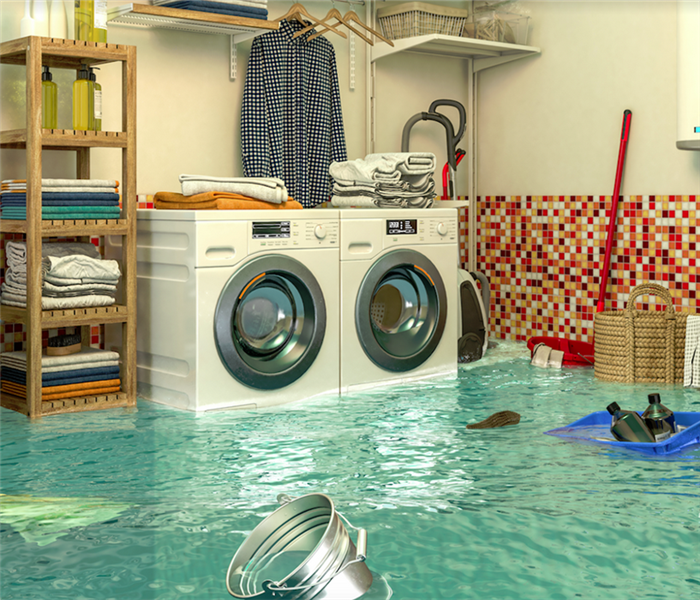 a flooded laundry room with water covering the floor