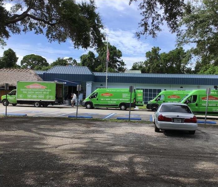 Green SERVPRO vehicles ready for action.