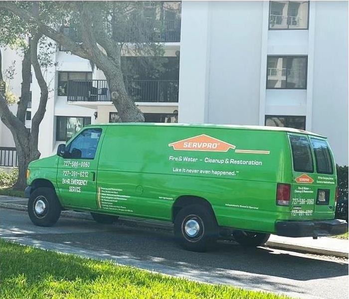 SERVPRO vehicle in front of multistory building